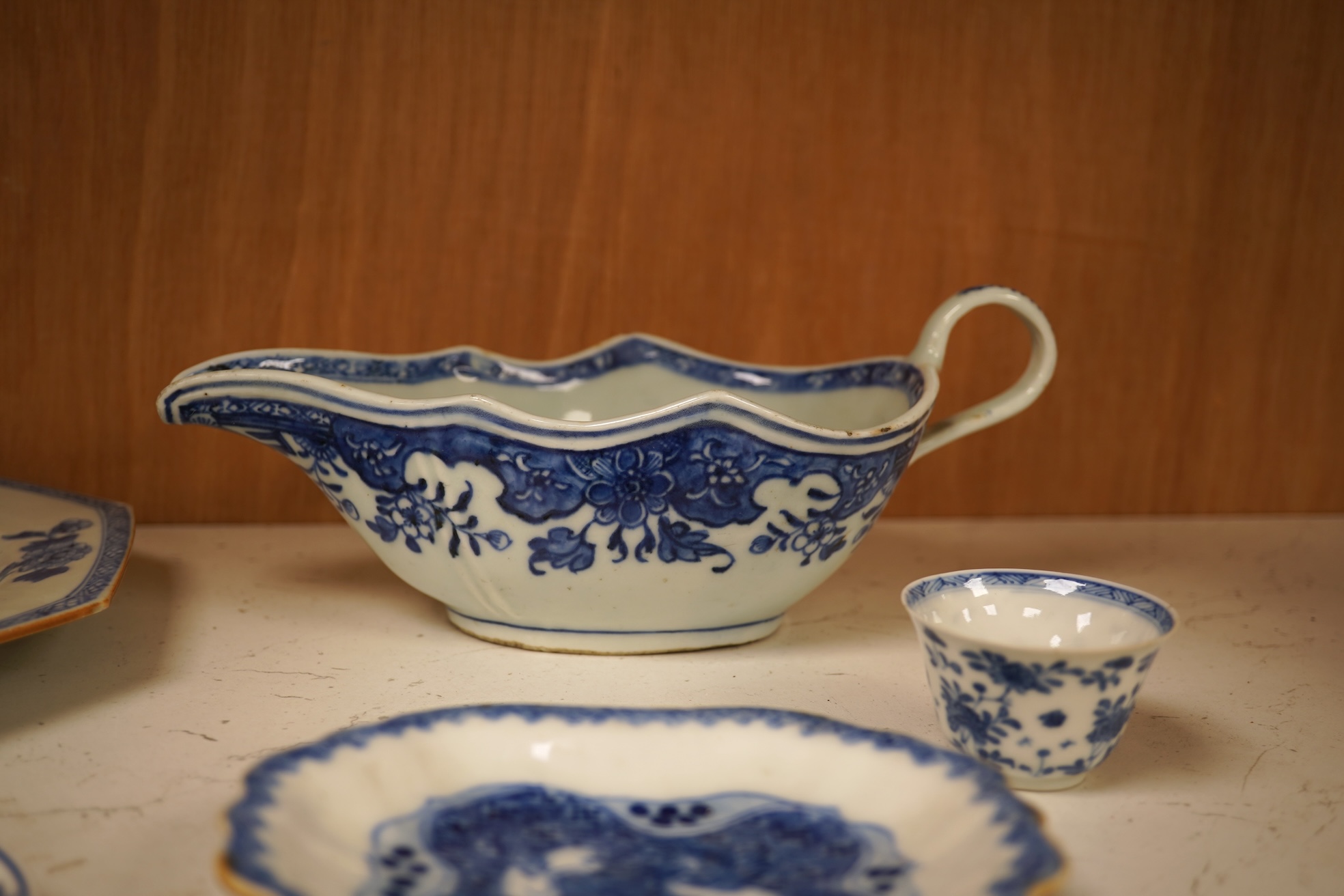 A Chinese export blue and white blue plate, sauceboat and Ko-sometsuke type dish together with a miniature tea bowl and two saucers. Plate 22cm diameter